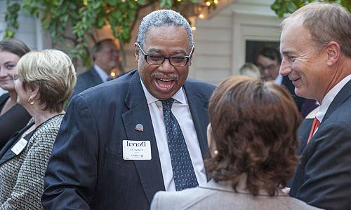 people greeting each other at a Carroll University event.